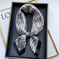 a zebra print scarf in a box