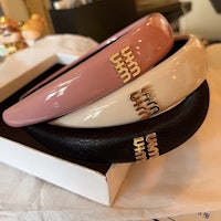 three headbands sitting on top of a box