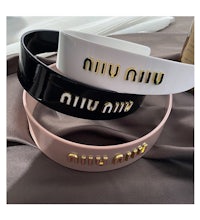 a black, white and gold belt with the word'uni vinci'on it