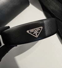 a black prada handbag with the logo on it