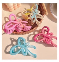 a bunch of colorful hair clips on a table